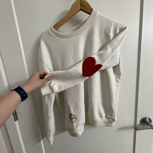 white sweatshirt, red hearts on elbows
